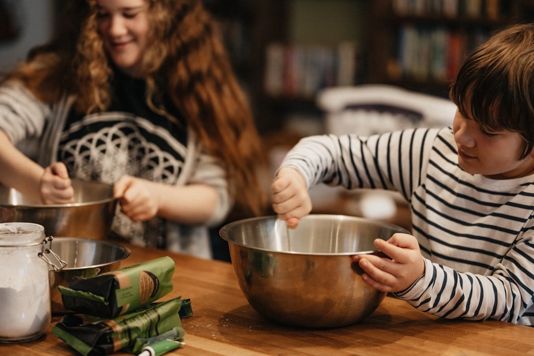 Kitty and Oz baking a Norman Castle cake for Ozzys History homework.